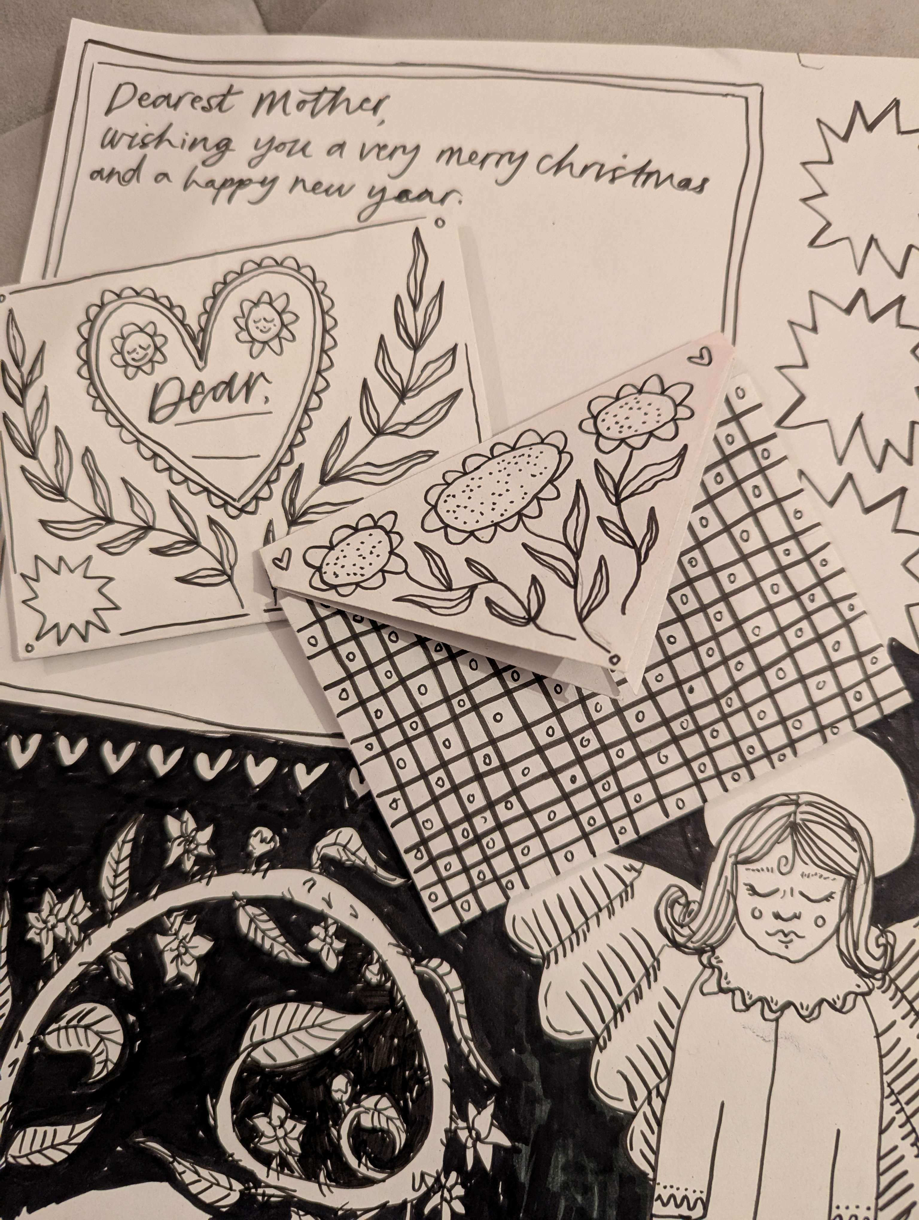 Main Image:  Black lettering and floral illustrations on white paper letters