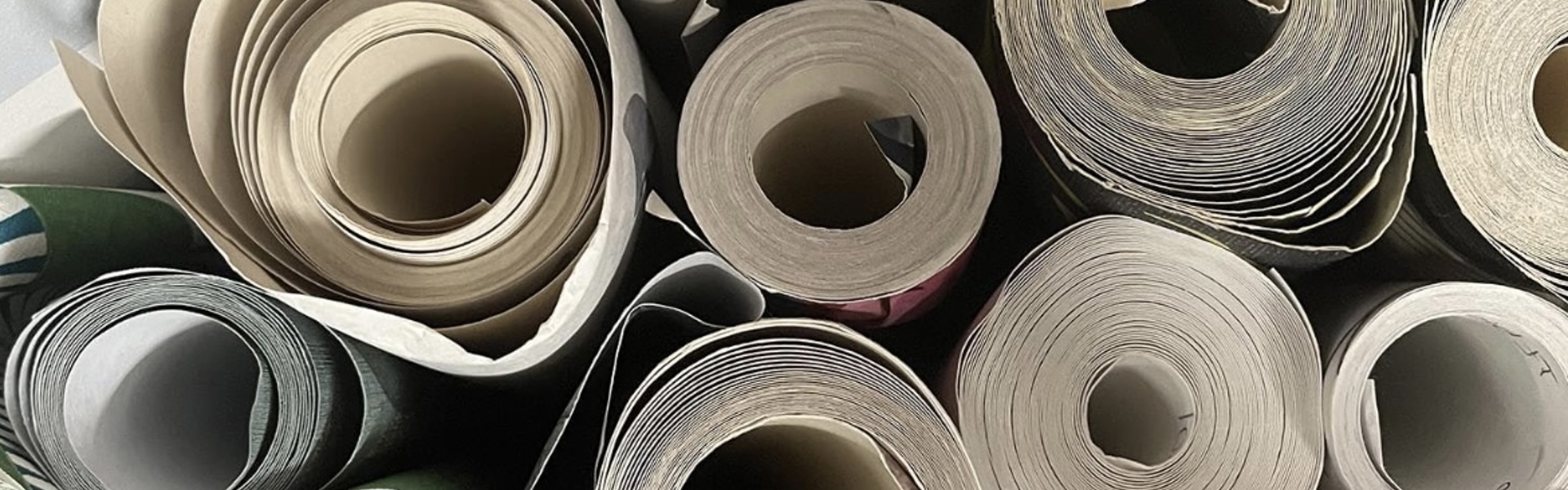 Main image: a photo of rolls of wallpaper from above, used to makeover an old lampshade. 