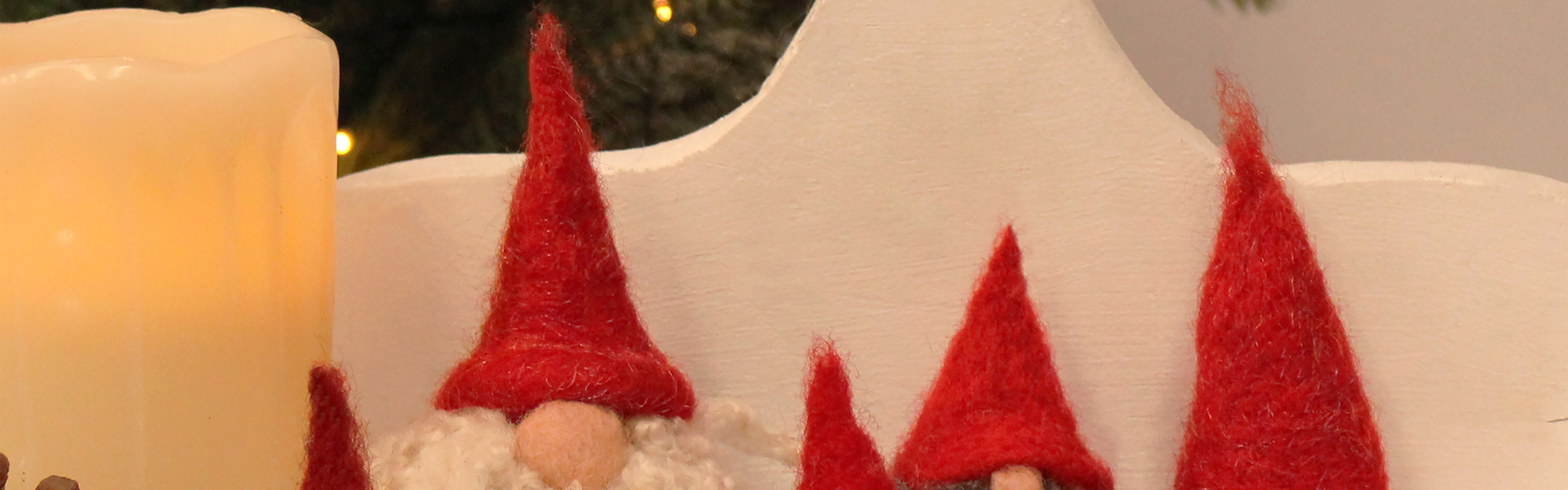 a close up of needle felted little gnomes (tomte) made by Steffi Stern