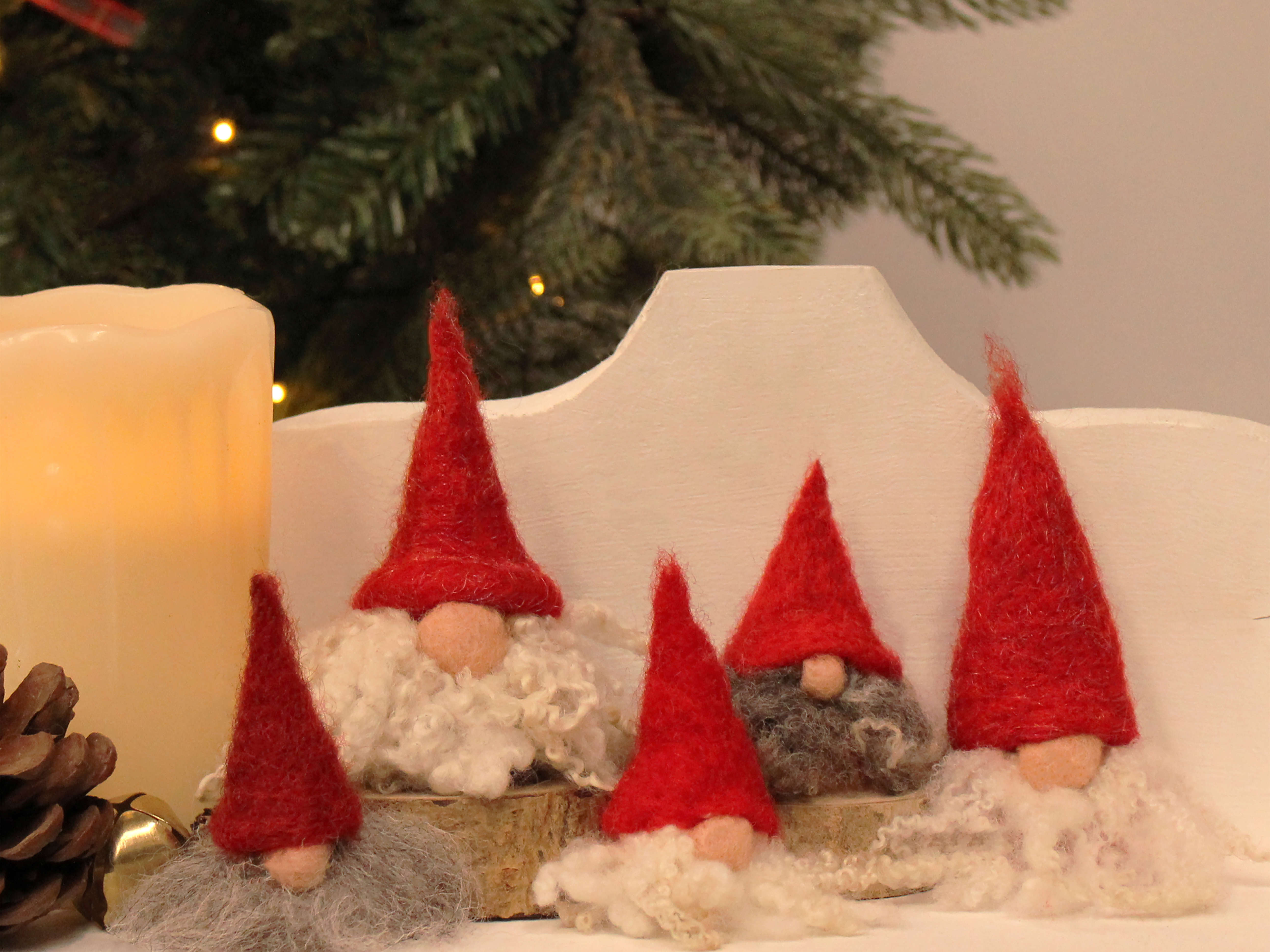 a close up of needle felted little gnomes (tomte) made by Steffi Stern