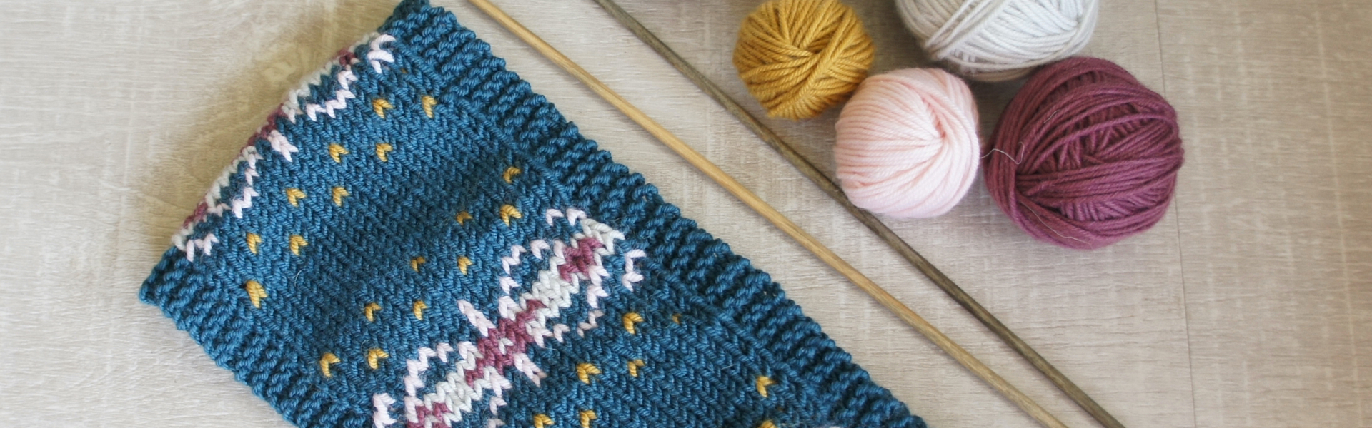 a hand knitted faire isle headband made by Jo Allport