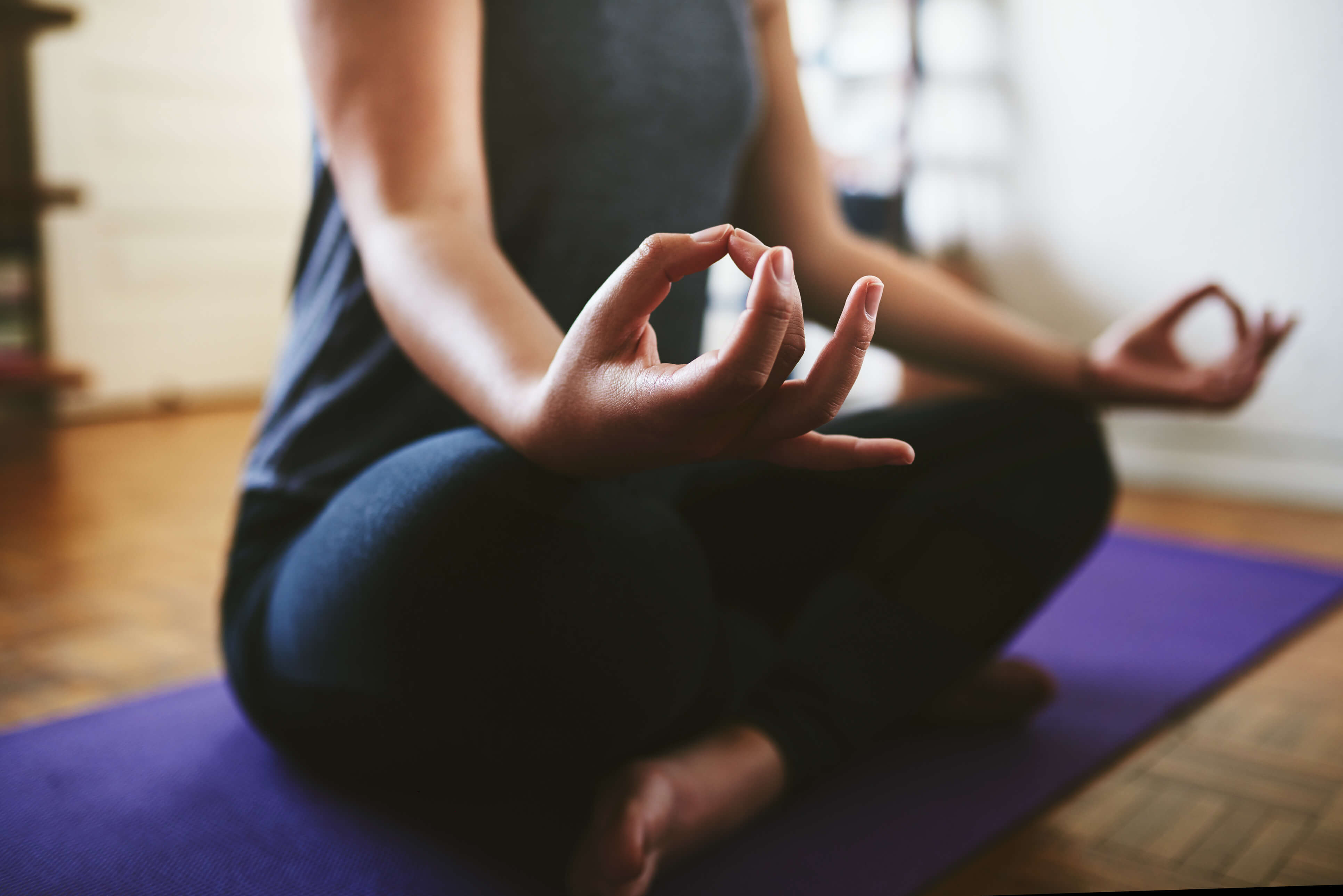 A close up of a woman doing Yoga