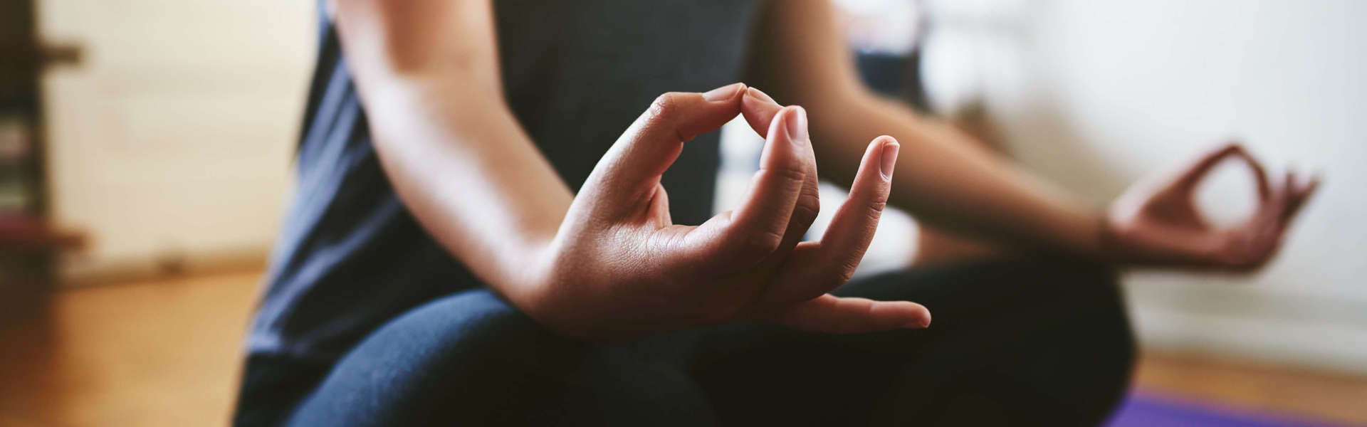 A close up of a woman doing Yoga