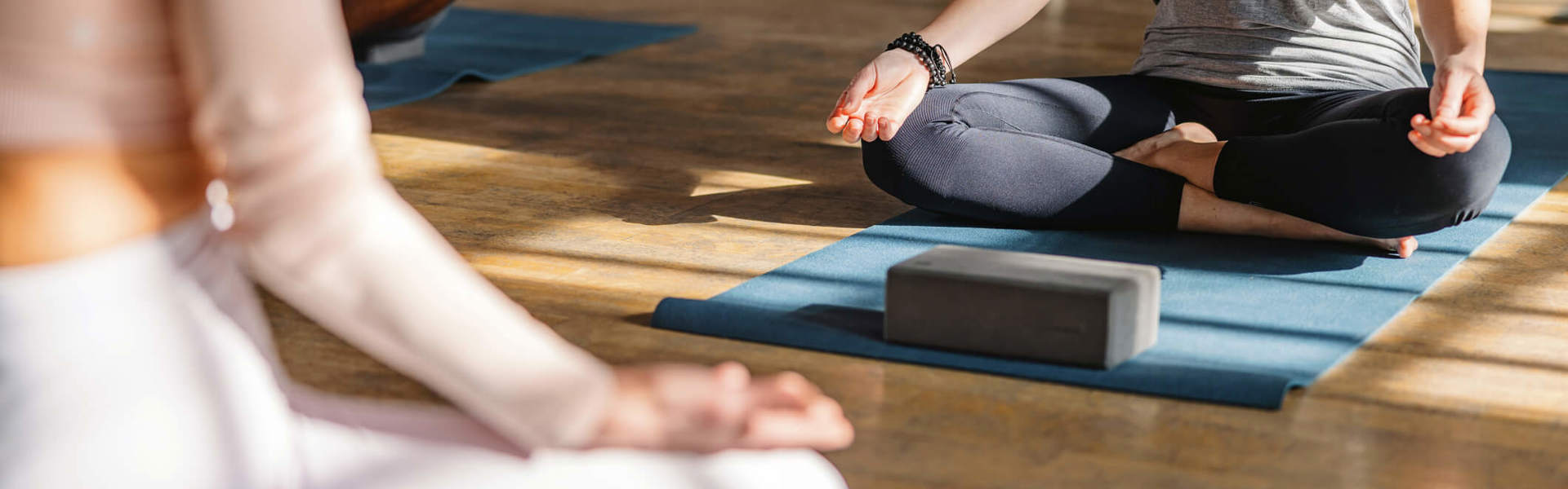 Close up of someone teaching a yoga class