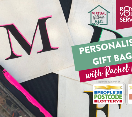 Hand printed green white and black polka dot napkin underneath a teacup and scone